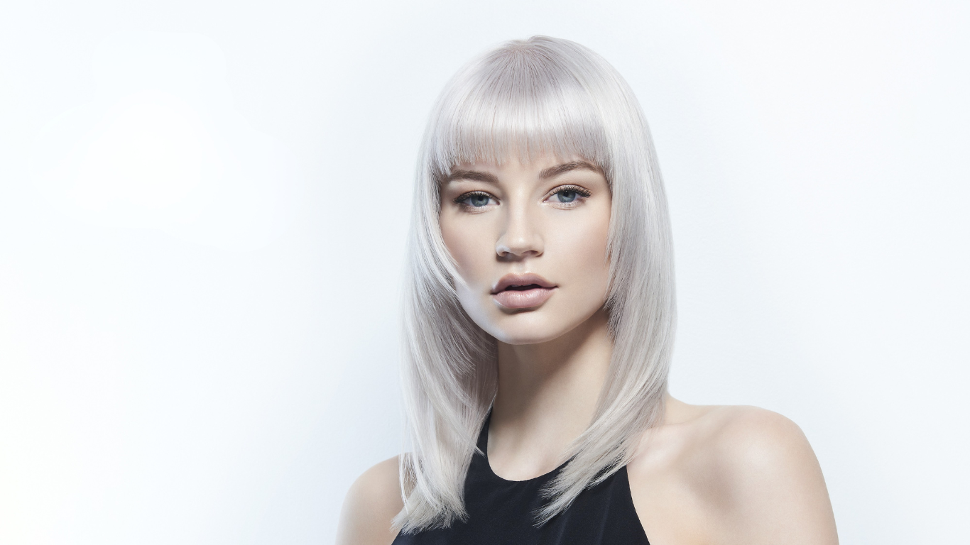 Close-up of a woman with bright blonde highlights and a sleek bob, representing blonde hair maintenance results from Jayne Elliott Hair Company in Lutterworth.