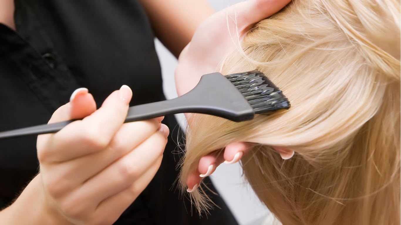 Woman with glossy, freshly tinted brunette hair – featured image for Cruz Hairworks blog on how to maintain vibrant, healthy colour in Whitley Bay.