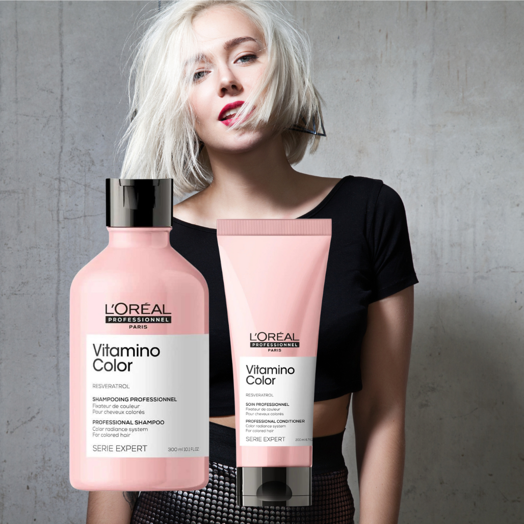Blonde woman with loreal shampoo and conditioner